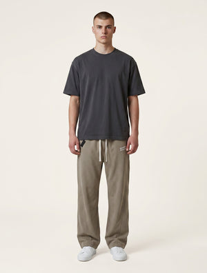 White London Clothing beige corduroy relaxed fit trousers with drawstring waist and embroidered logo.