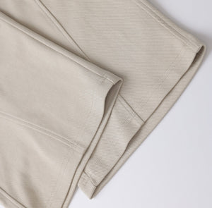 White London Clothing beige relaxed fit trousers made from soft, durable fabric with a tailored cut.