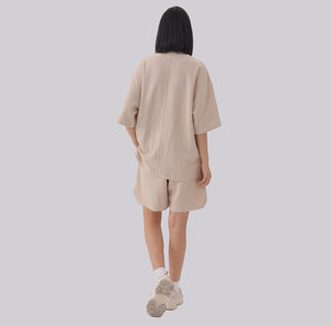 White London Clothing beige textured cotton shorts with elasticated waistband and side pockets.
