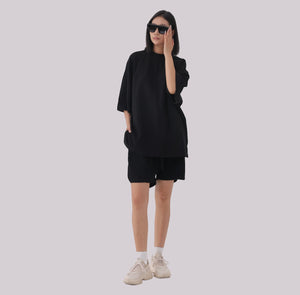 White London Clothing black oversized textured shorts made from heavy weight jersey cotton with an elasticated waistband and side pockets.