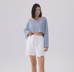 White London Clothing light blue oversized fit long sleeve cropped sweatshirt with white drawstring shorts featuring logo detail.