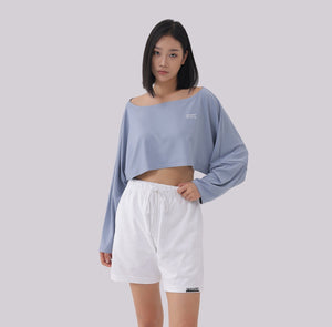 White London Clothing dusty blue oversized fit long sleeve cropped sweatshirt with white logo detail on chest.