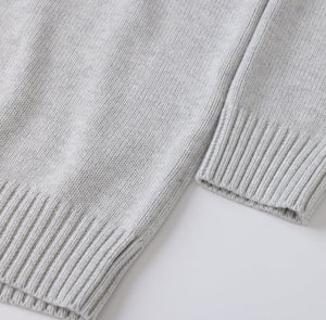 White London Clothing light grey oversized merino wool blend sweater with textured boucle yarn and ribbed cuffs and hem.