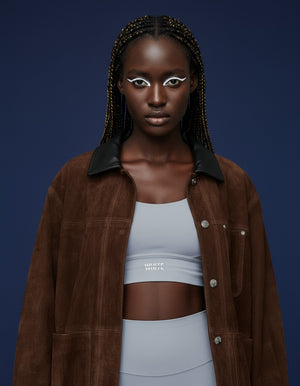 White London Clothing light blue sculpt sports bra with spaghetti straps and removable padding.