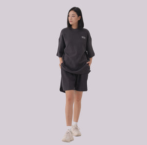 White London Clothing charcoal grey oversized textured shorts made from heavy weight cotton jersey with an elasticated waistband and side pockets.