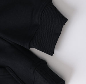 White London Clothing black 100% cotton structured hoodie with ribbed cuffs and a printed logo on the back.