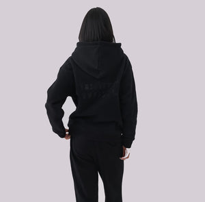 White London Clothing black 100% cotton hoodie with large logo print on back and small logo on chest. Model wearing size M.