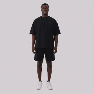 White London Clothing black oversized textured shorts made from heavy weight jersey cotton with an elasticated waistband and side pockets.