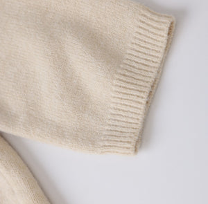 White London Clothing taupe knitted sweater made from premium yarn, featuring a ribbed cuff and hem. Perfect for women seeking cozy elegance.