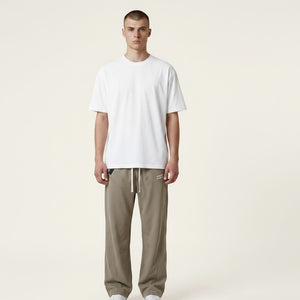 White London Clothing men's relaxed fit beige corduroy trousers with drawstring waist and subtle logo detail.