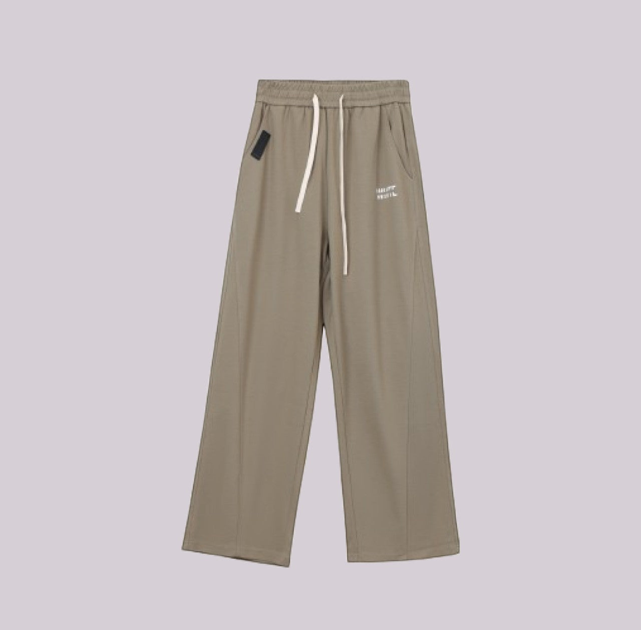 White London Clothing beige relaxed fit trousers with drawstring and subtle logo detail.