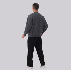 White London Clothing black casual fit trousers on a man, made from soft fabric.