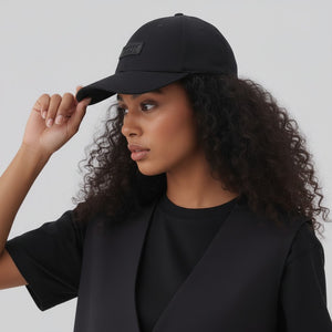 White London Clothing black cotton twill unisex cap with a tonal embroidered patch and pre-curved brim.