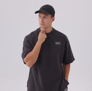 White London Clothing black cotton twill baseball cap with tonal embroidered logo patch and adjustable strap.