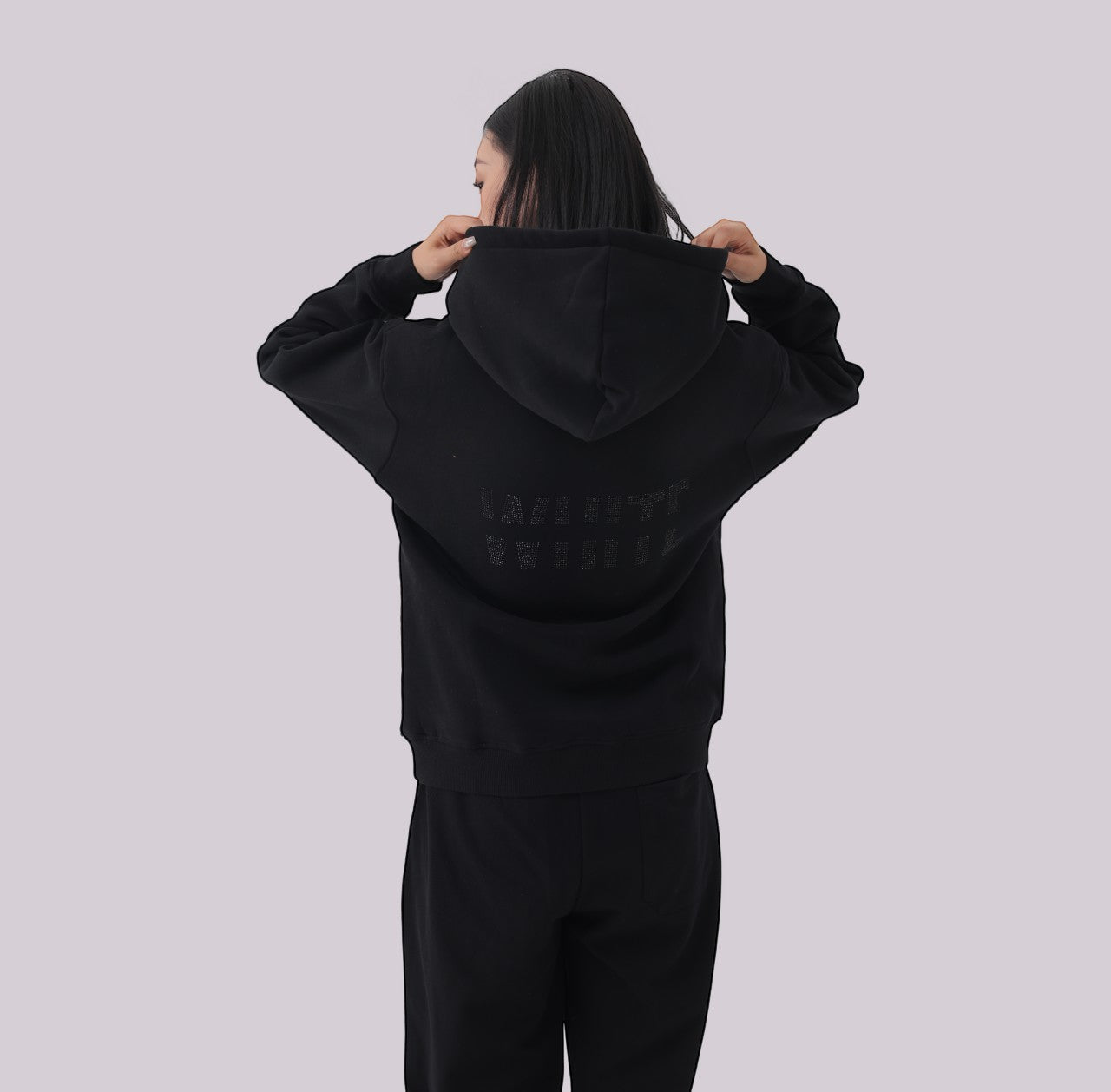 White London Clothing black 100% cotton hoodie with large logo print on back and small logo on chest. Model wearing size M.