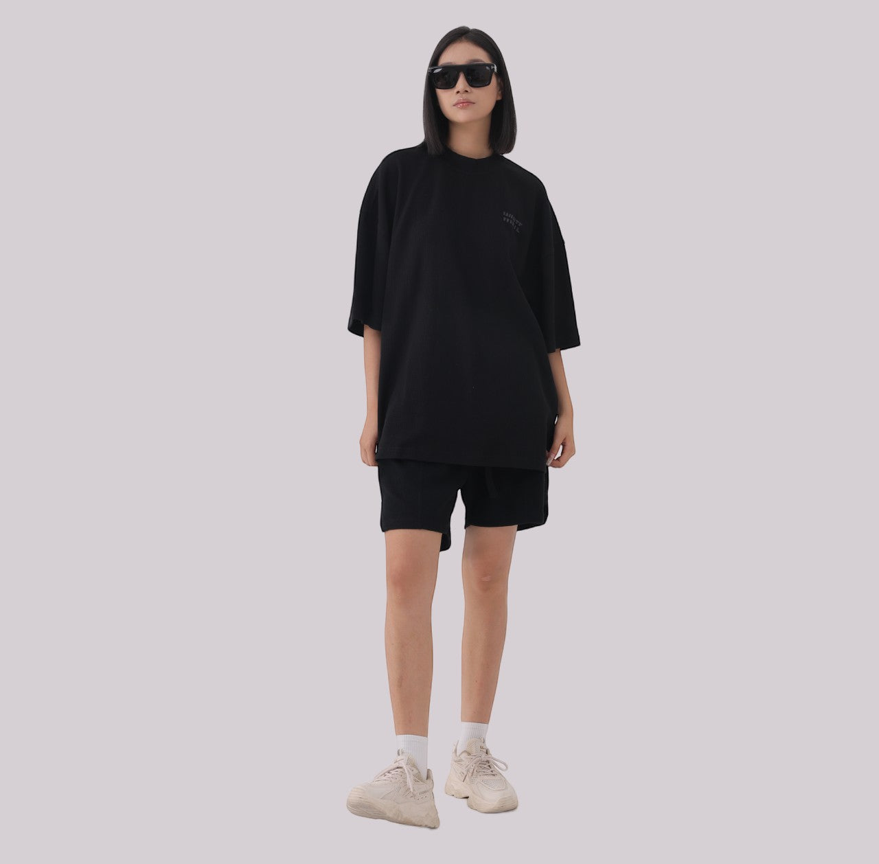 White London Clothing black heavyweight jersey cotton shorts with elasticated waistband and subtle logo accent on left leg.