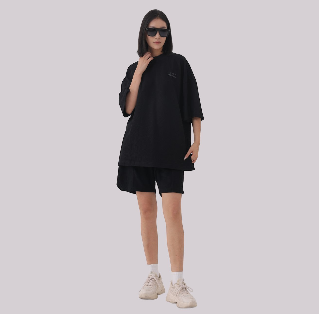 White London Clothing black oversized jersey shorts with elasticated waistband and subtle logo accent on left leg.