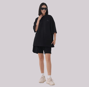White London Clothing black oversized jersey shorts with elasticated waistband and subtle logo accent on left leg.