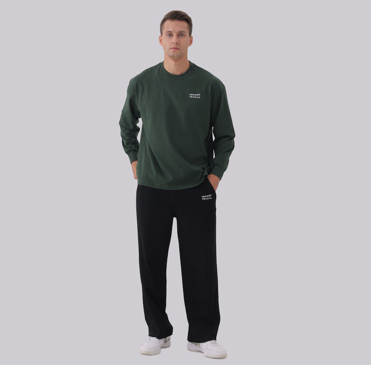 White London Clothing black relaxed fit trousers with white logo detail. Men's casual wear.