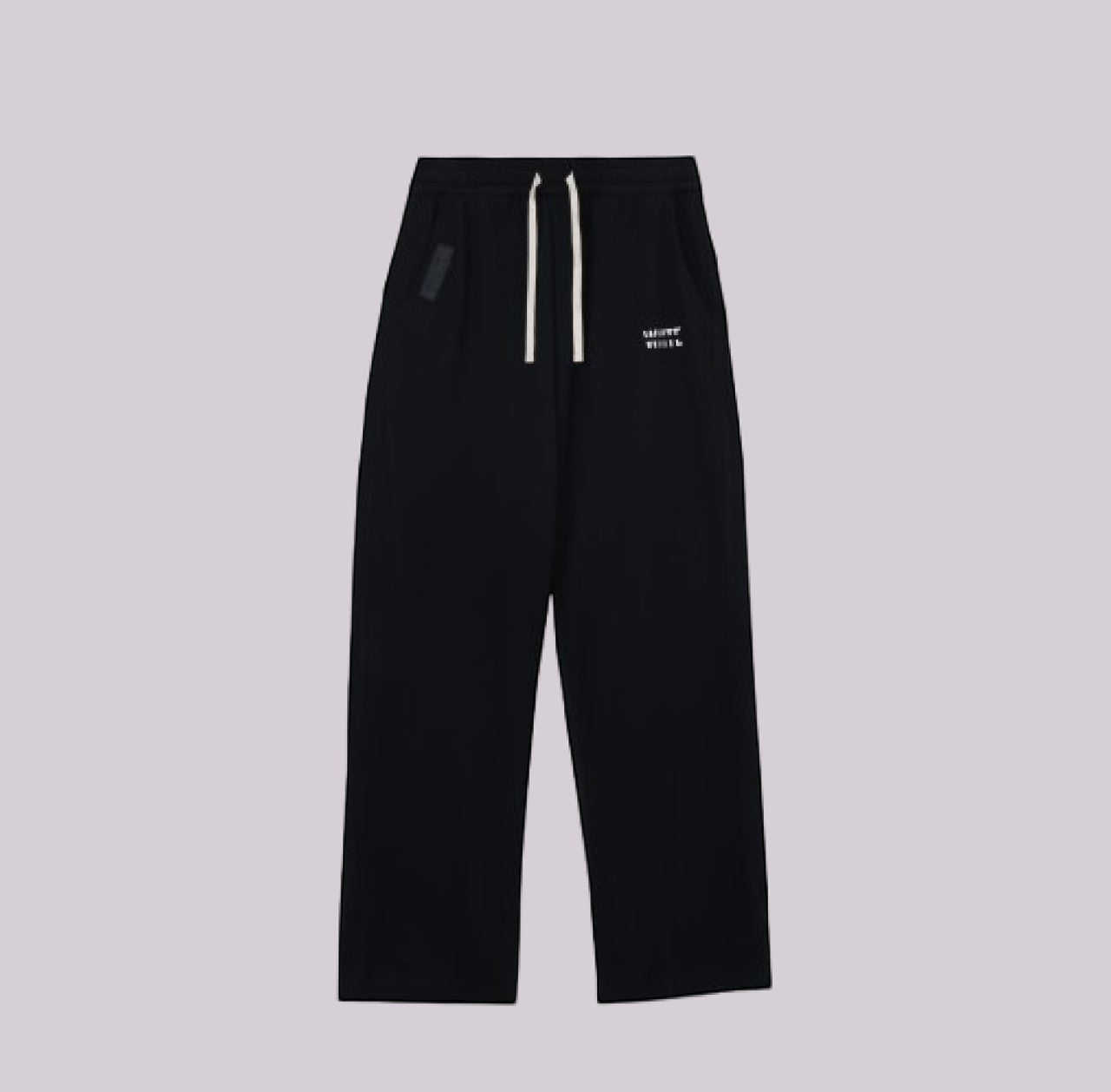 White London Clothing black relaxed fit trousers with drawstring waist and subtle logo detail.