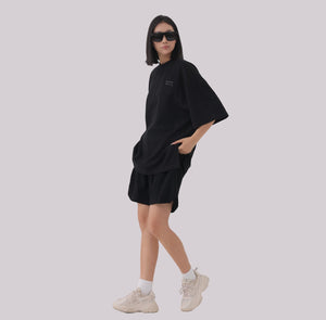 White London Clothing black oversized textured shorts made from heavy weight jersey cotton with an elasticated waistband and side pockets.