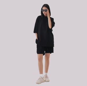 White London Clothing black oversized textured shorts made from heavy weight jersey cotton with an elasticated waistband and side pockets.