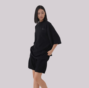 White London Clothing black oversized textured jersey shorts with elasticated waistband and drawstring. Relaxed fit.