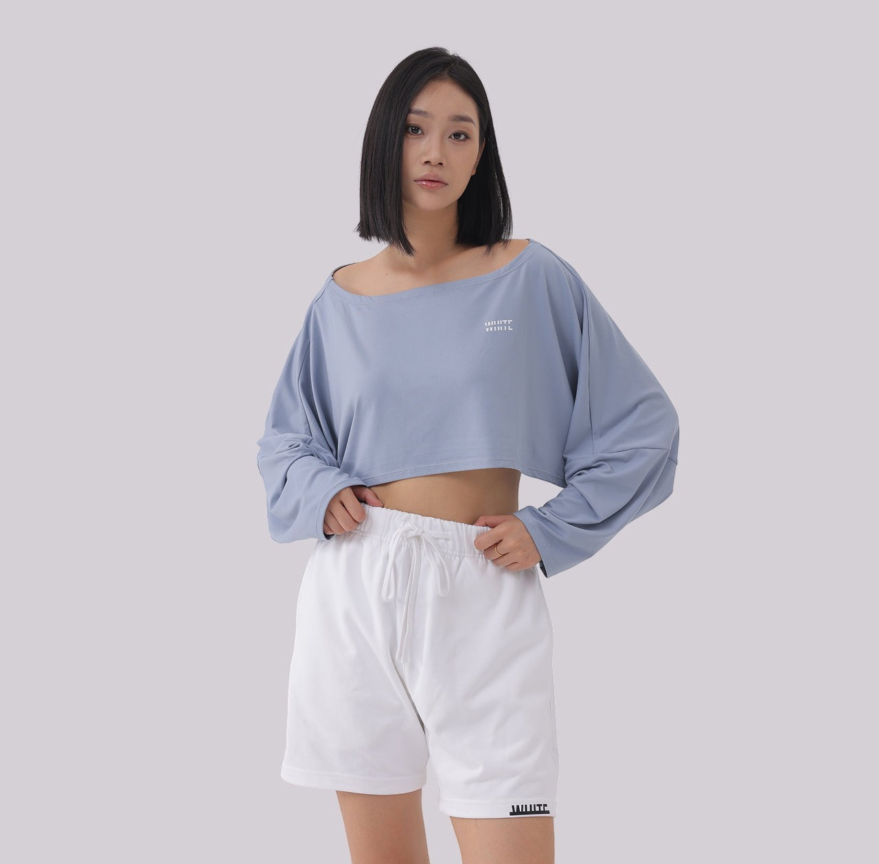 White London Clothing light blue oversized fit long sleeve cropped sweatshirt with white logo detail on chest.