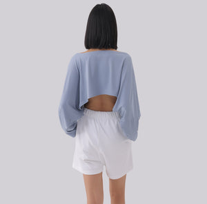 White London Clothing light blue oversized fit long sleeve cropped sweatshirt with open back detail.