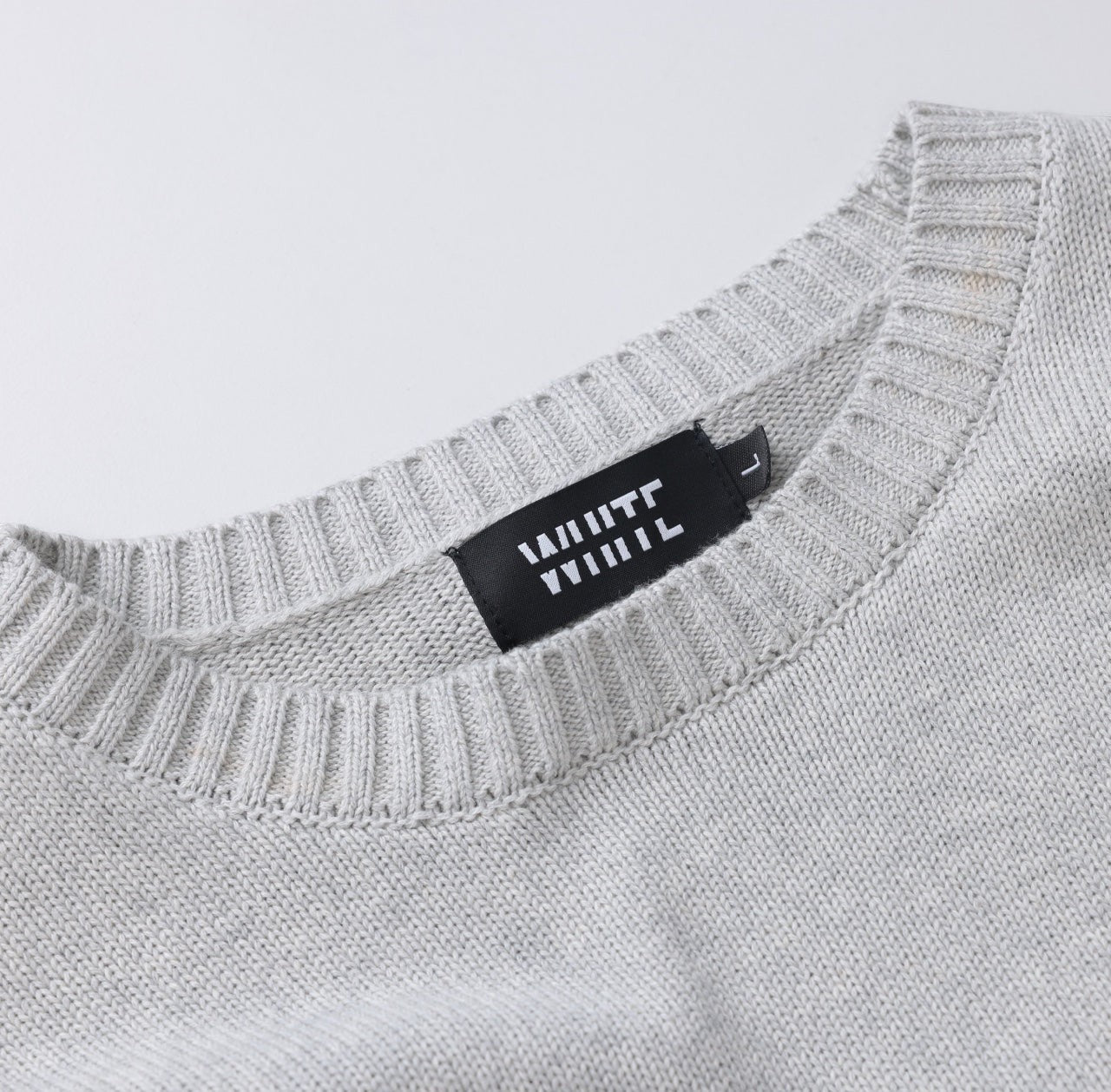 White London Clothing light grey merino wool blend knitted sweater with textured boucle yarn and oversized fit.