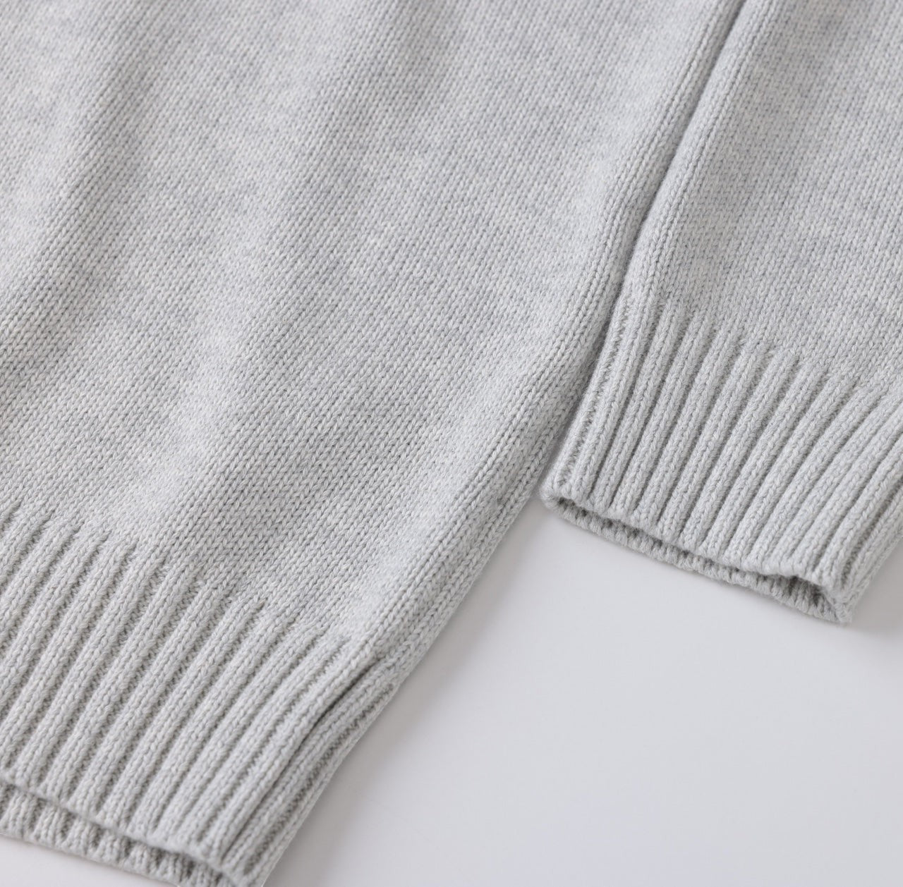 White London Clothing light grey oversized merino wool blend sweater with textured boucle yarn and ribbed cuffs and hem.