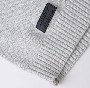 White London Clothing light grey knitted merino wool blend sweater with textured boucle yarn and embossed logo tag.