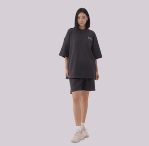 White London Clothing charcoal grey oversized textured jersey shorts with elasticated waistband and side pockets.