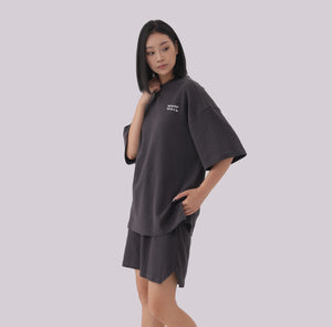White London Clothing charcoal grey oversized textured shorts with elasticated waistband and subtle logo detail.