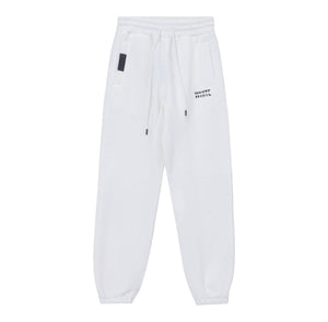 White London Clothing white cotton jersey joggers with cropped length, drawstring waist, and embroidered logo on left thigh.