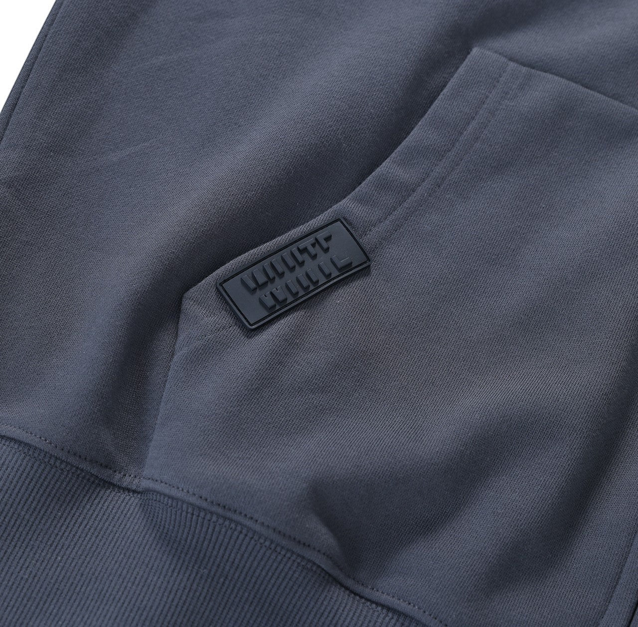 White London Clothing dark grey 100% jersey zip-up hoodie with dropped shoulders and a rubber logo patch.
