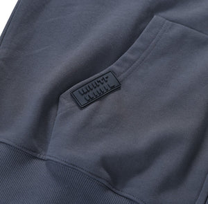 White London Clothing dark grey 100% jersey zip-up hoodie with dropped shoulders and a rubber logo patch.