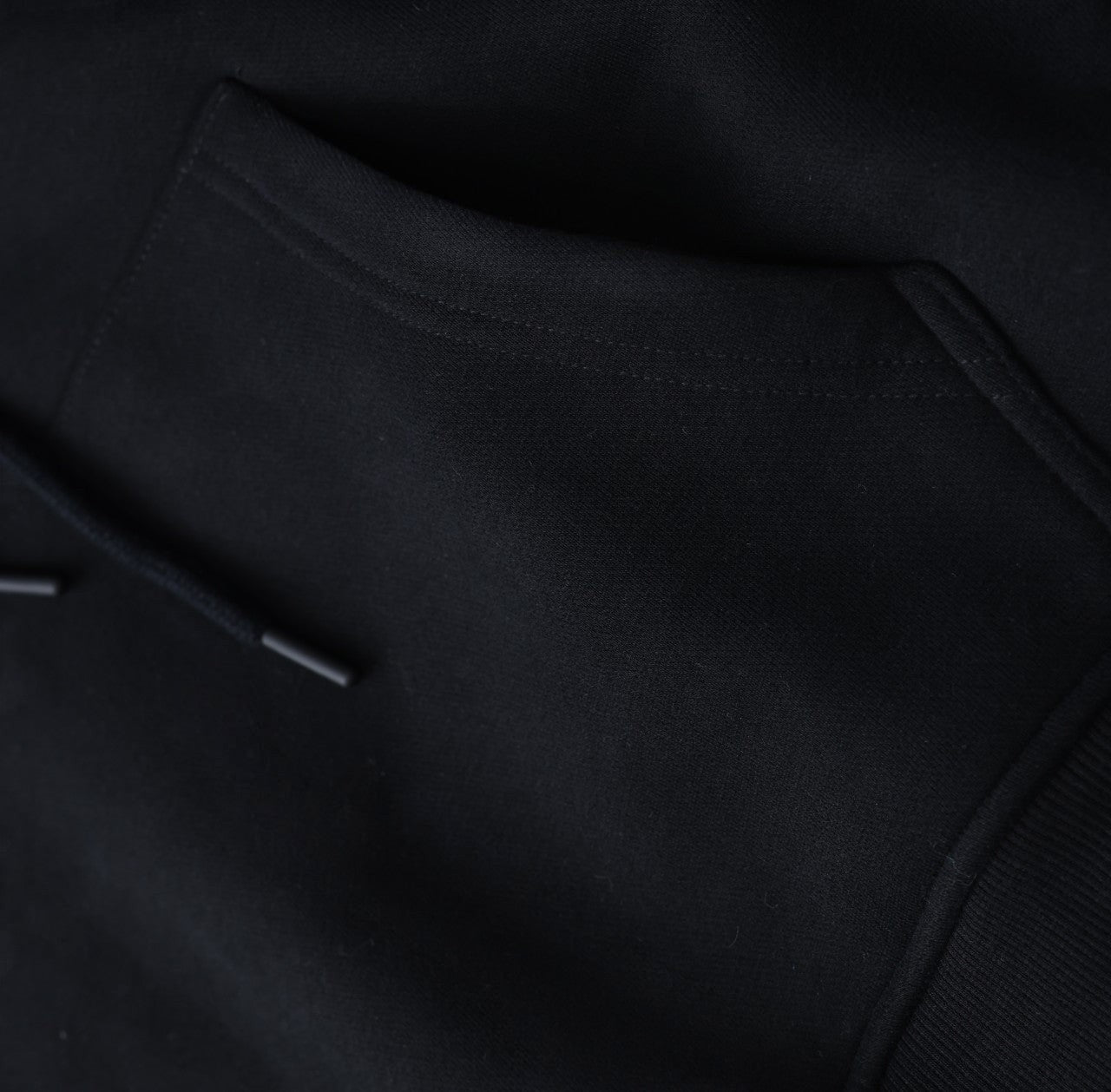 White London Clothing black 100% cotton signature hoodie with a front pocket and drawstring. Designed in London.