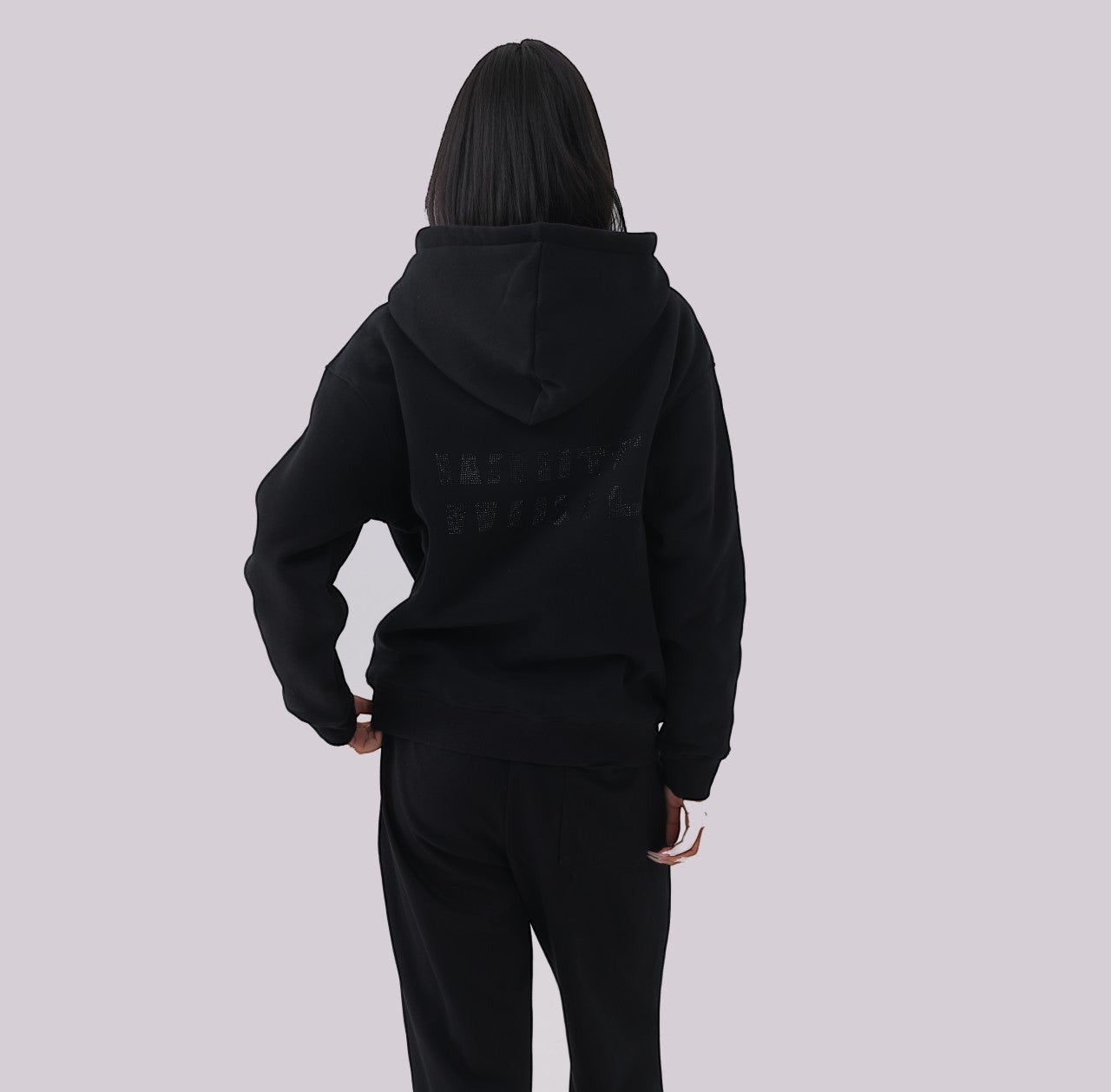 White London Clothing black 100% cotton hoodie with large logo print on back and small logo on chest. Model wearing size M.
