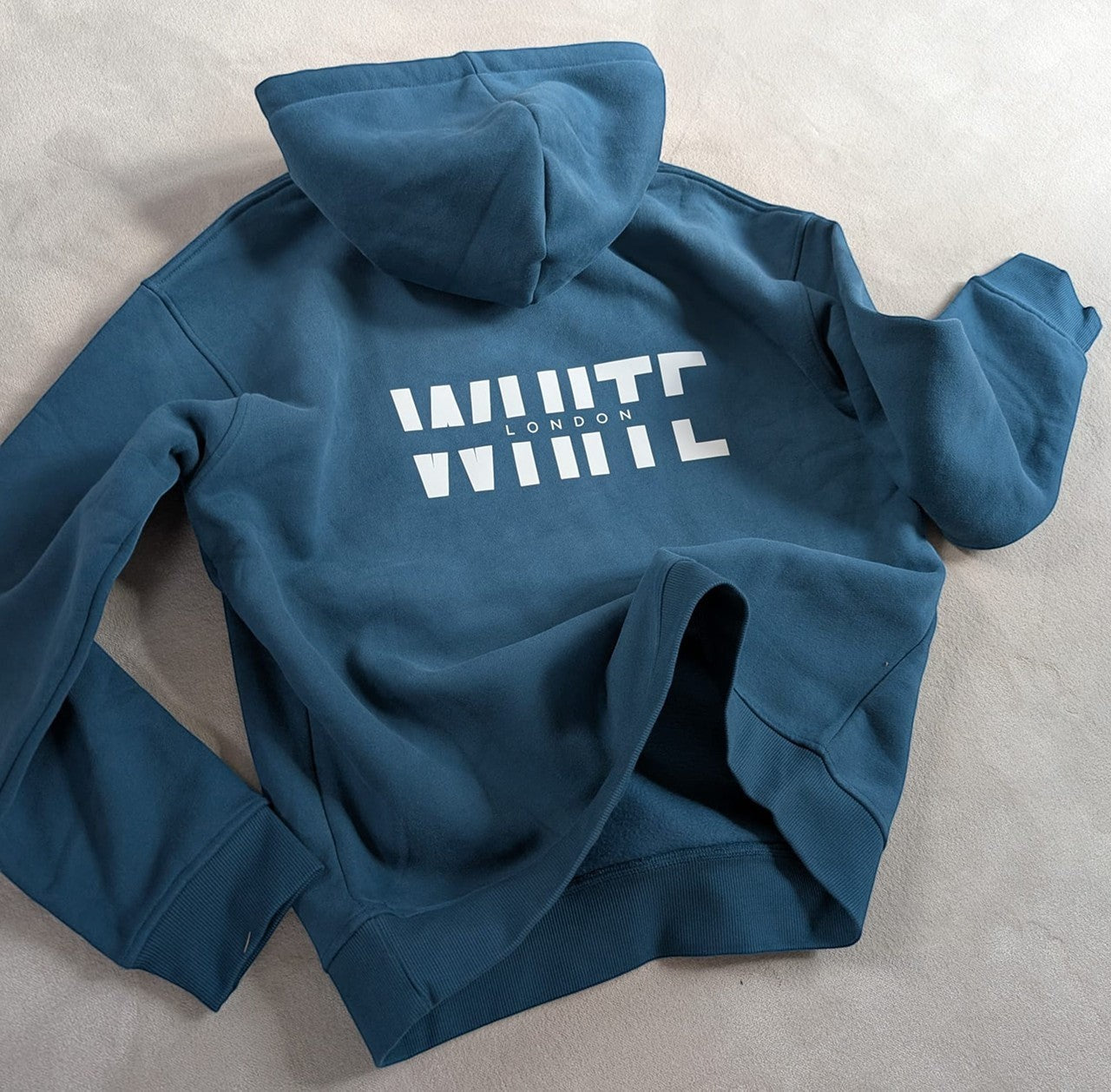 White London Clothing cobalt blue 100% cotton signature hoodie with large white logo print on back and chest.