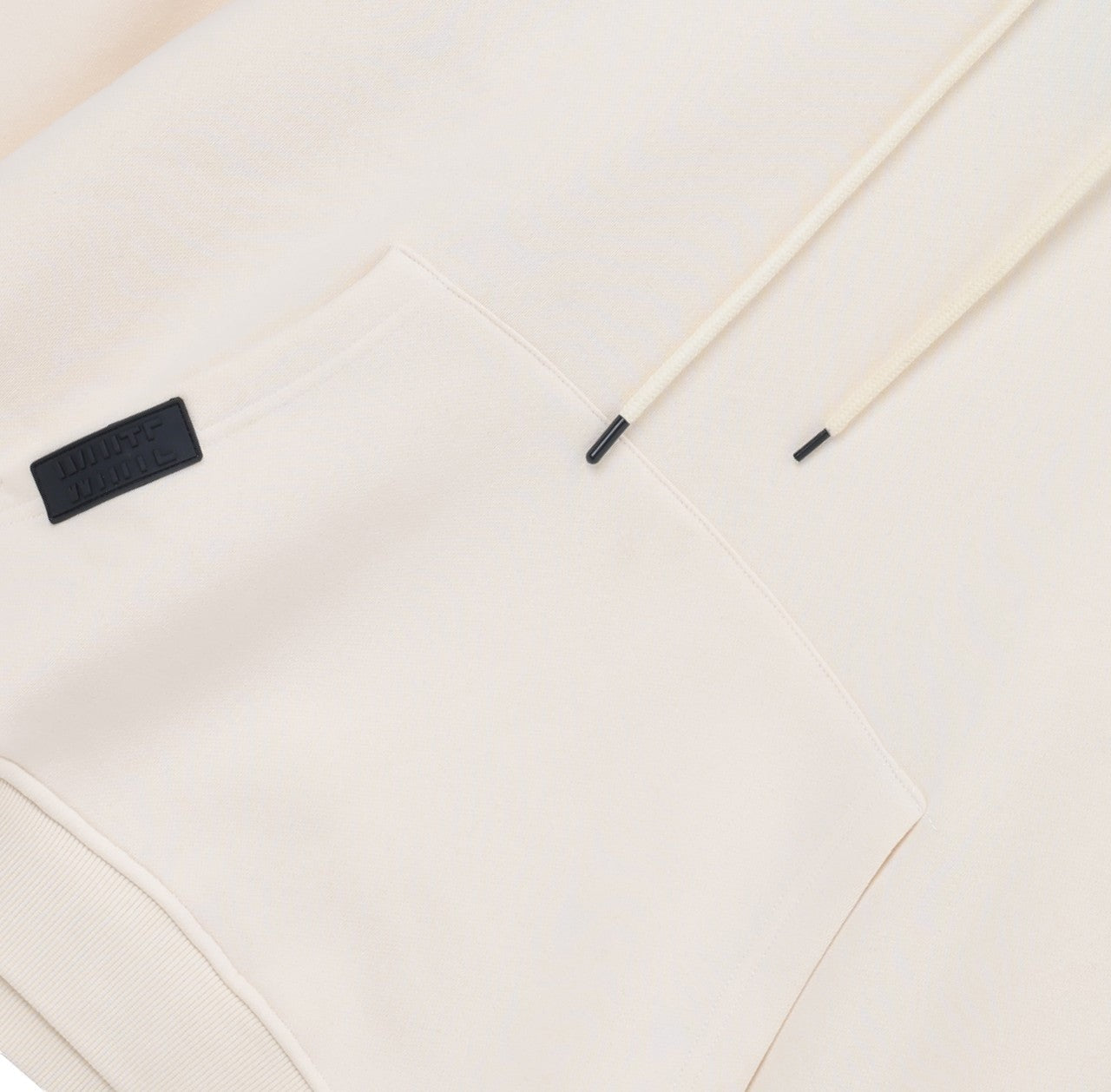 White London Clothing cream beige 100% cotton hoodie with drawstring and embossed logo tag on pocket.