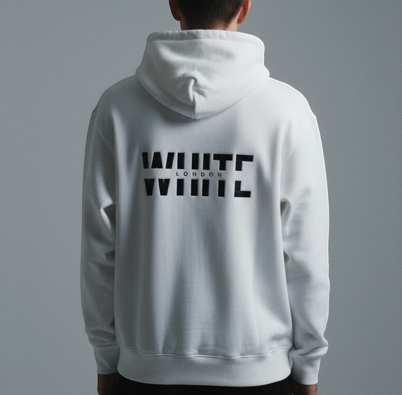 White London Clothing white 100% cotton hoodie with large black logo print on back and chest. Model wearing size M.